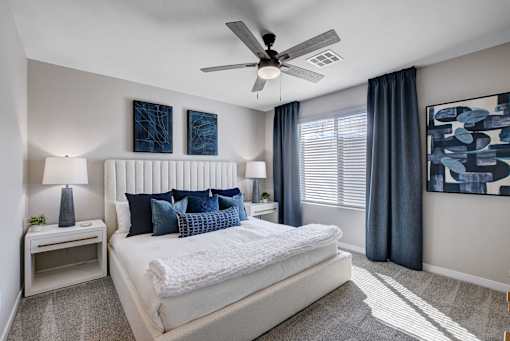 Bedroom With Ceiling Fan at Copper Creek Apartments, Nevada 