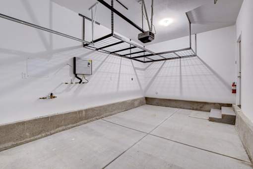 A room with a white floor and walls, a white ceiling, and a white door.at Copper Creek Apartments, Las Vegas