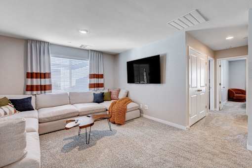Carpeted Living Area at Copper Creek Apartments, Nevada