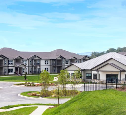A row of houses with a white pathway in front.