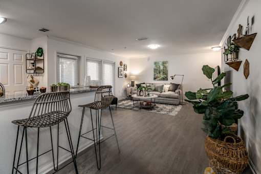 A living room with a bar area and a couch.
