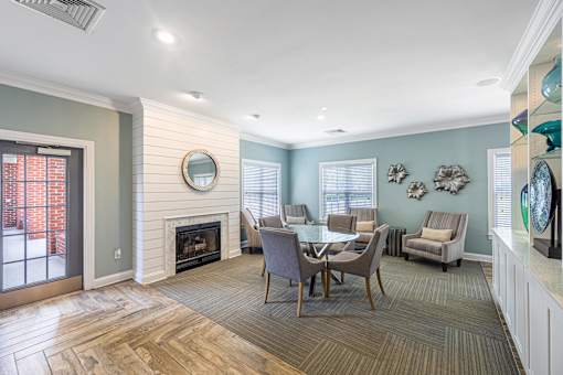 a dining room with a table and chairs and a fireplace