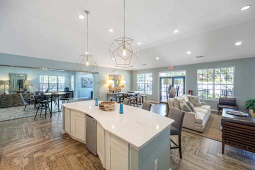 a large living room with a kitchen and a dining room