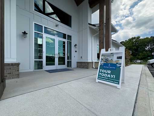 A sign in front of a building advertises a tour today.