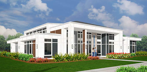 A modern house with a white exterior and large windows.