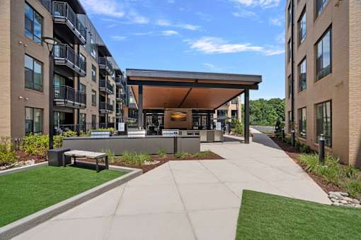 A modern building with a covered walkway between two sections.