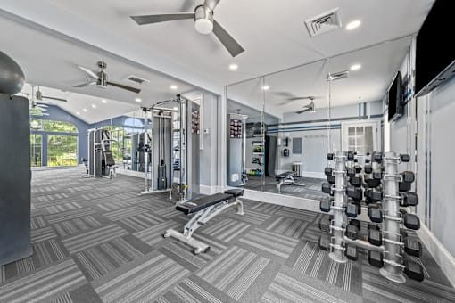 A well-equipped gym with a variety of exercise equipment. at Heights at New Garden apartments in Greensboro, NC.