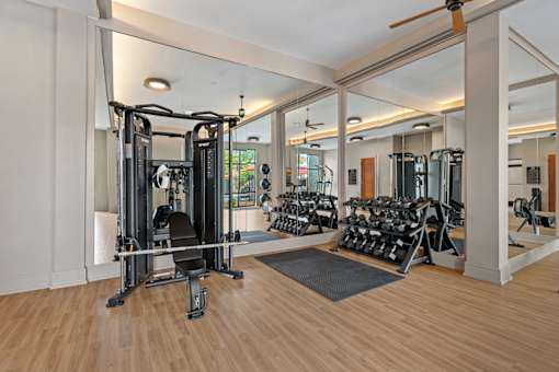 A gym with a variety of exercise equipment