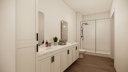 A white bathroom with a sink, mirror, and shower.