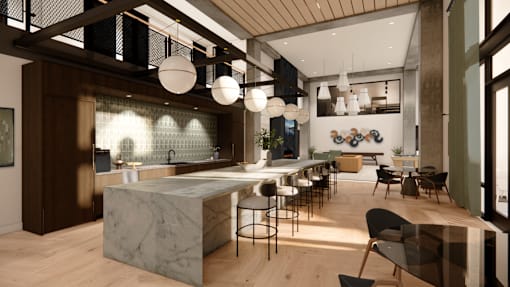 A modern kitchen with a marble island and wooden floors.