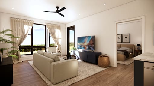 A modern living room with a large window and a ceiling fan.