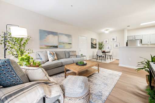 A living room with a grey couch and a coffee table.