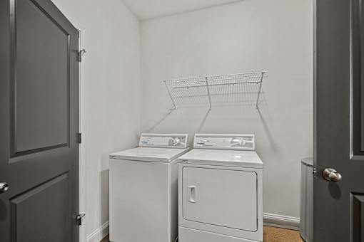 A laundry room with a washer and dryer.
