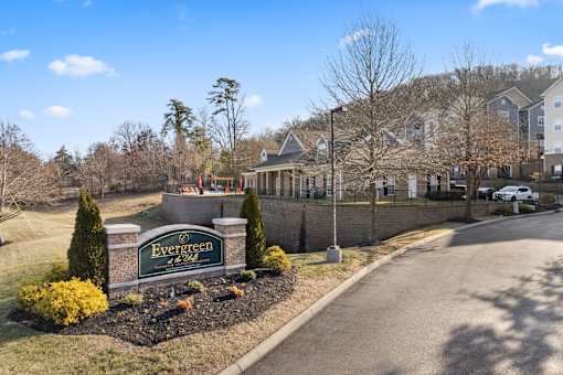 Sign for Evergreen at the Bluffs apartments in Knoxville, TN.