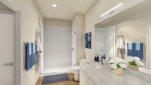 A bathroom with a sink, mirror, and toilet.