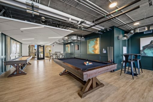 a game room with a pool table and ping pong table at Lakeview 3200 Apartments, Chicago, Illinois