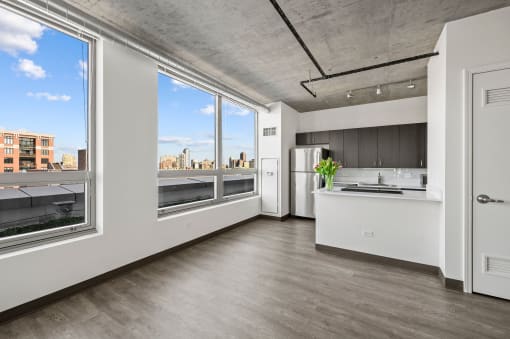 a kitchen with a large window and a view of a city at Lakeview 3200 Apartments, Chicago, IL, 60657