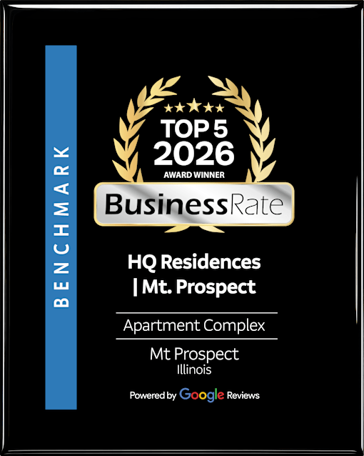 A black and gold award sign for HQ Residences Mt. Prospect.