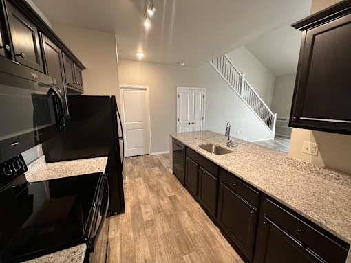 Kitchen with black appliances at Fountain Ridge, Pleasant Prairie, 53158