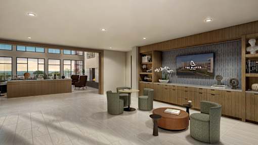 A spacious waiting room with a large window and a flat screen TV mounted on the wall.