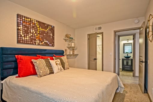 Apartments for Rent Nashville - The Canvas - Spacious Bedroom with Plush Carpeting, Stylish Decor, and a Closet