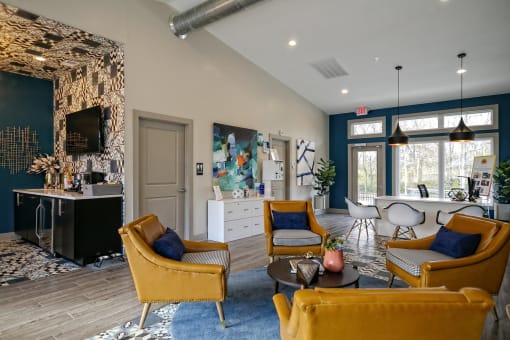 The Retreat apts at Indian Lake  lobby in hendersonville with midcentury modern seating area and coffee corner with TV.