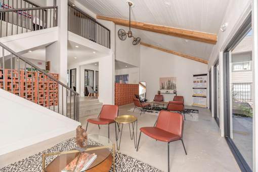 Fusion 35 clubhouse with a white ceiling and a staircase on the left side.