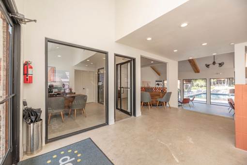 Fusion 35 leasing office interior with a glass door leading to the clubhous earea.