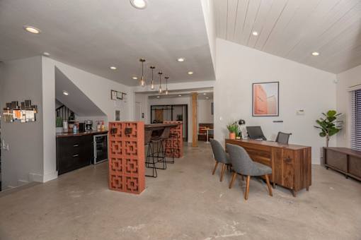 Fusion 35 clubhouse kitchen with a dining area and a workspace.