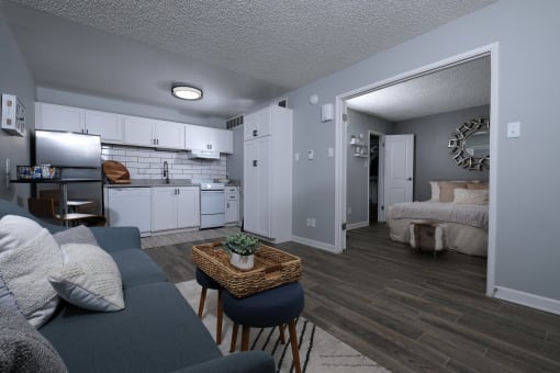 Fusion Fort Worth efficiency apartment in Haltom City interior with classic kitchen, open concept living area, and large bedroom.