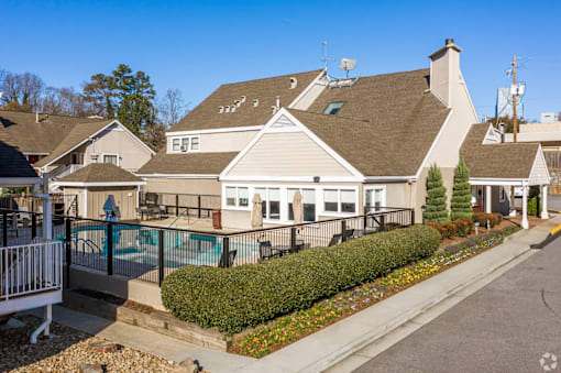A residential area with apartments and a pool.