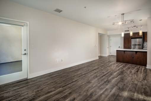 Fusion Encore Hollywood Apartments with a wooden floor and a white door.