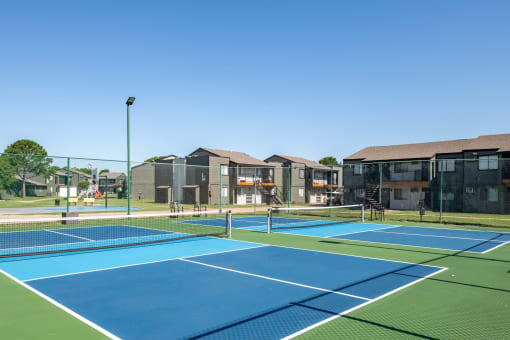 Apartments with outdoor pickleball courts at fusion fort worth apartments in haltom city, Texas