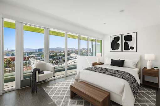 Fusion Hollywood bedroom with a large bed and a view of the city.