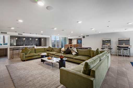 Fusion Hollywood luxury apartments with a large couch and a coffee table.
