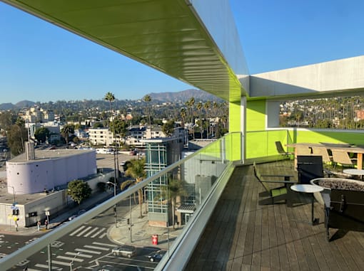 Fusion Hollywood Apartments view of Hollywood Los Angeles from a rooftop with a green wall.