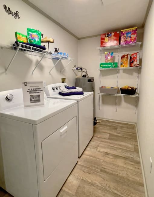 Walk-in pantry in the Retreat at Indian Lake one bedroom apartments in Hendersonville with built in wire shelving and in-unit laundry.