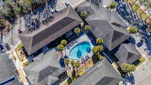 A bird's eye view of Mandarin Bay Apartments with a swimming pool.