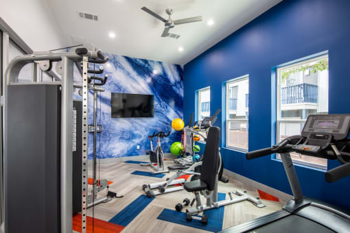 Fully equipped fitness center at Stadium 700 apartments in Arlington, Texas