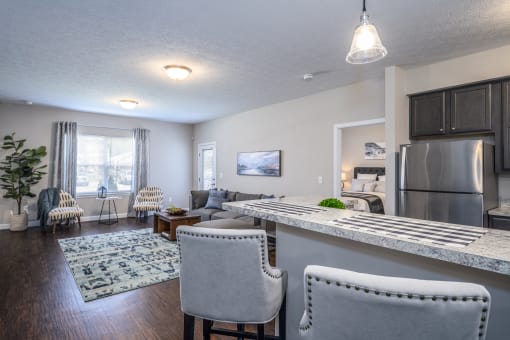 Arbors at Turnberry pet friendly apartments and townhomes Pickerington, Ohio wood style flooring, stainless steel appliances, spacious living room with a kitchen and dining area