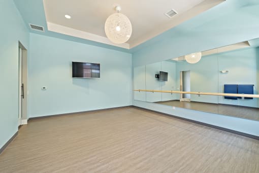 A yoga room and fitness center with free weights are available as an amenity.