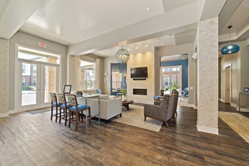 The updated and renovated clubhouse features a game room with a pool table, a full kitchen, and a coffee bar with comfortable seating.
