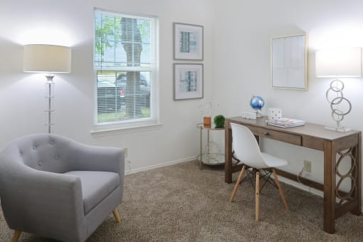 Work-from-home-ready bedroom with a desk and chair in a 555 Waverly unit