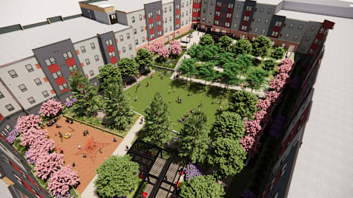 A park area surrounded by buildings.