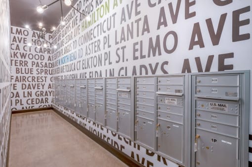 a wall with a bunch of gray school lockers