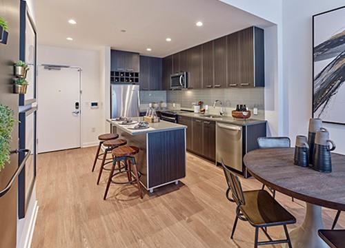 a kitchen and dining area with a table and chairs
