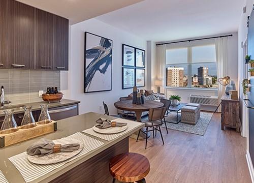 a living room with a kitchen and a dining room