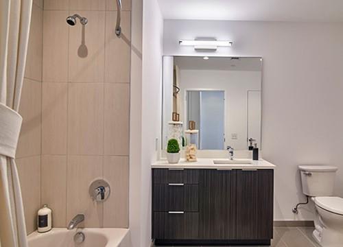 a bathroom with a sink toilet and a shower
