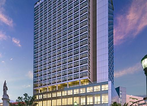 a tall building with many windows on the side of it