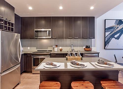 a kitchen with a counter top and a refrigerator
